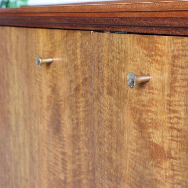 Vintage teak sideboard with rich wood grain, slender brass handles, British mid-century design by Robert Heritage.