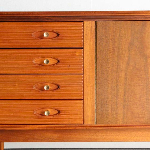 Mid-century British vintage teak sideboard by Robert Heritage, featuring rich wood grain, four drawers with brass knobs, and .