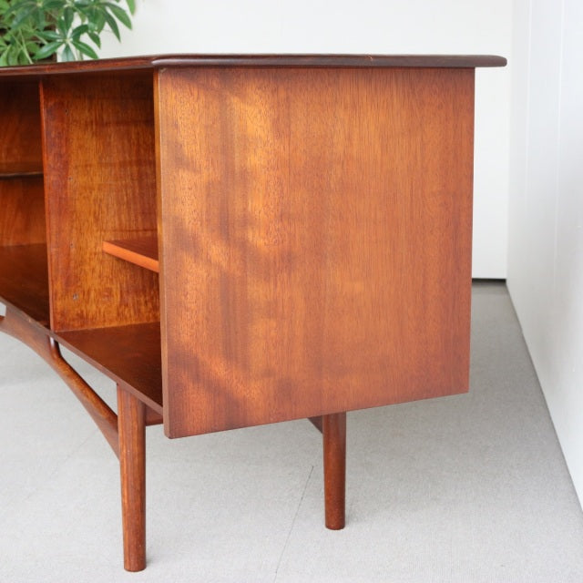 Mid-century vintage British teak sideboard by Dalescraft with smooth wood grain and slender tapered legs.