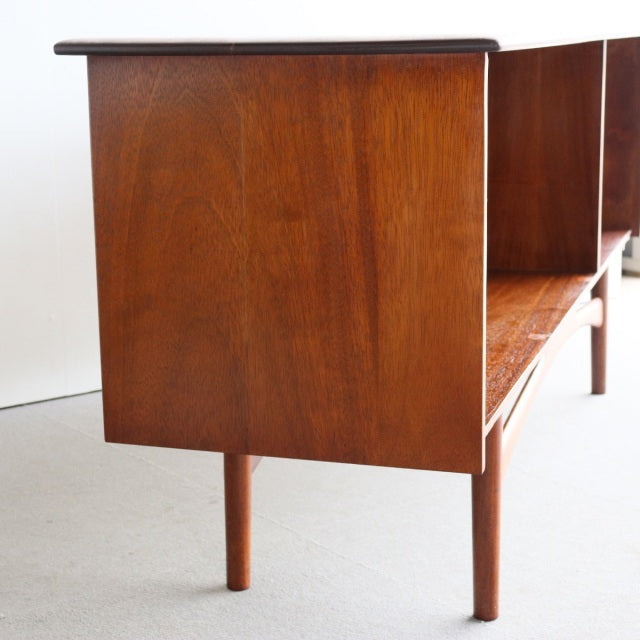 British mid-century teak sideboard by Dalescraft with rich wood grain and slender rounded legs.