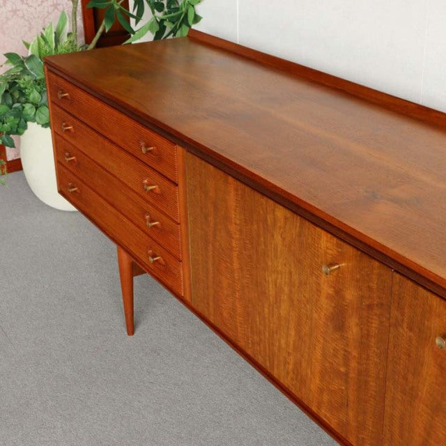 Vintage mid-century teak sideboard by Robert Heritage for Archie Shine, British design with clean wood grain, tapered legs,.