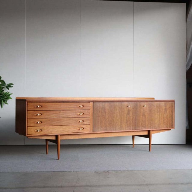 Vintage teak sideboard by Robert Heritage for Archie Shine, British mid-century design with sleek wood grain, tapered legs,.