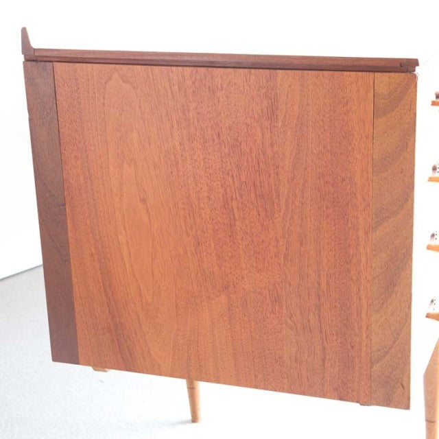 Mid-century British vintage teak sideboard by Robert Heritage for Archie Shine, showcasing rich wood grain and tapered legs.