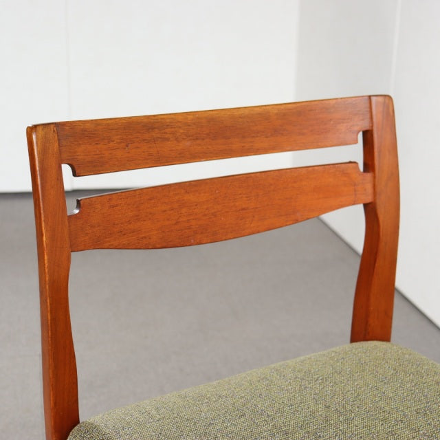 Vintage mid-century teak dining chair by Nathan, British design with curved backrest and green upholstered seat.