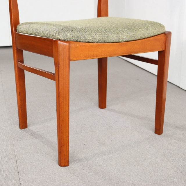 Vintage mid-century teak dining chair with British design, clean wood grain and cushioned beige seat from Nathan.