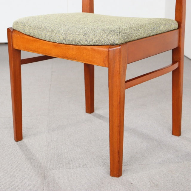 Vintage mid-century teak dining chair by Nathan with reupholstered light gray fabric seat, showcasing clean lines and.