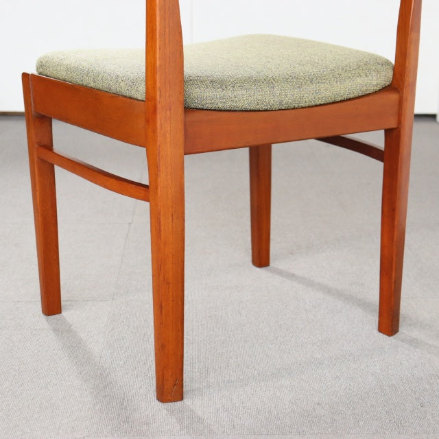 Mid-century vintage teak dining chair with light gray upholstered seat and clean British design from Denmark.