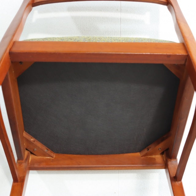 Vintage teak dining chair from British mid-century Denmark design, showing solid wood frame and new fabric seat underside.