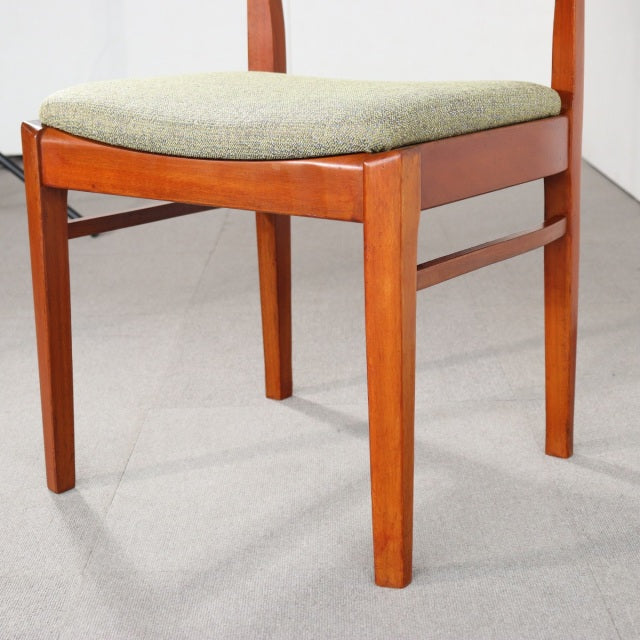 Vintage teak dining chair by NATHAN with clean mid-century British design, tapered legs, and light fabric seat cushion.
