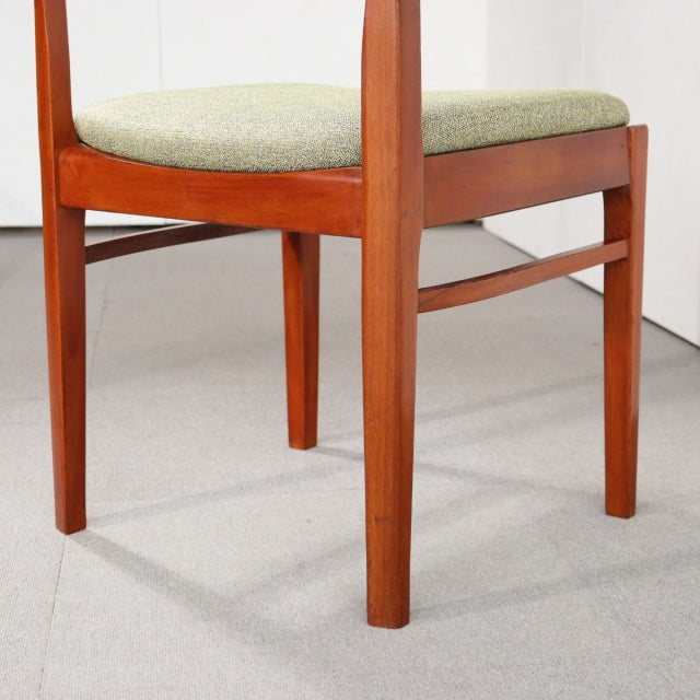 Vintage teak dining chair by NATHAN with sleek mid-century British design, visible wood grain, and cushioned seat.