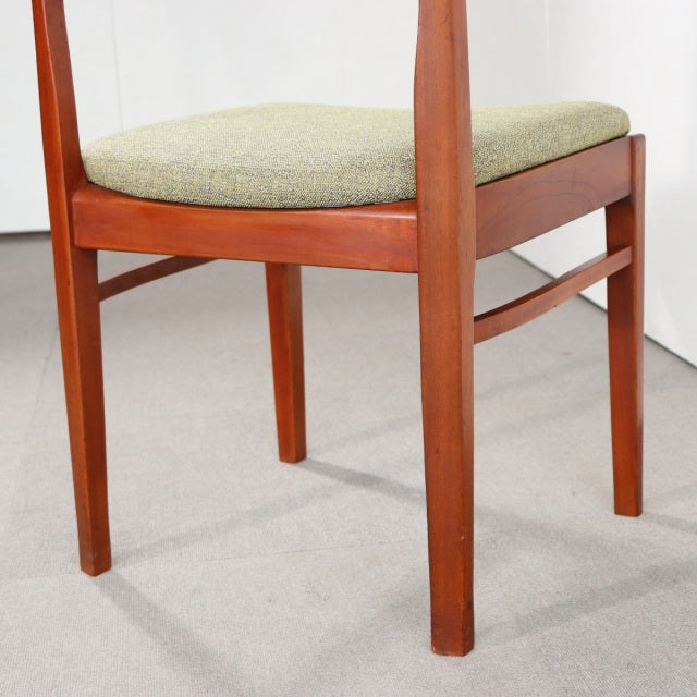Vintage mid-century teak dining chair by Nathan, British design with Danish influence, showcasing rich wood grain and.