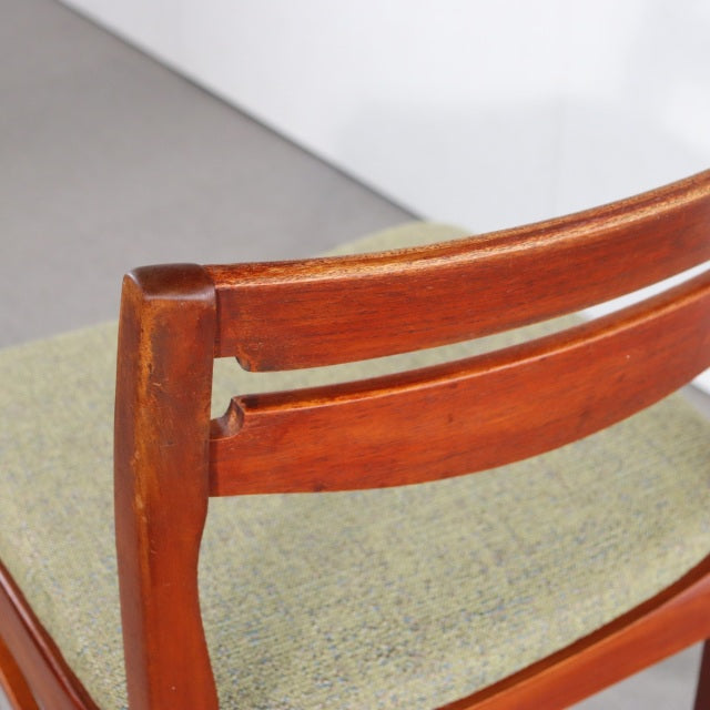 Vintage mid-century teak dining chair by NATHAN, British design with smooth wood grain and beige upholstered seat, featuring .