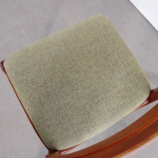 Vintage teak dining chair seat cushion with textured olive green fabric, sleek mid-century British design from Nathan.