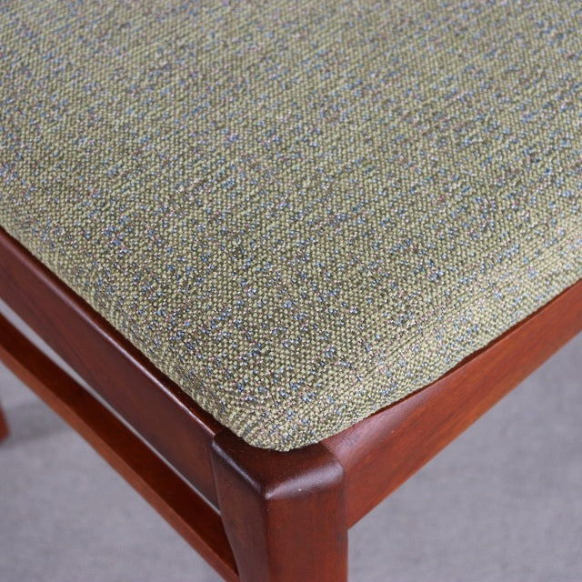 Mid-century British vintage NATHAN dining chair with teak frame and textured beige upholstery.