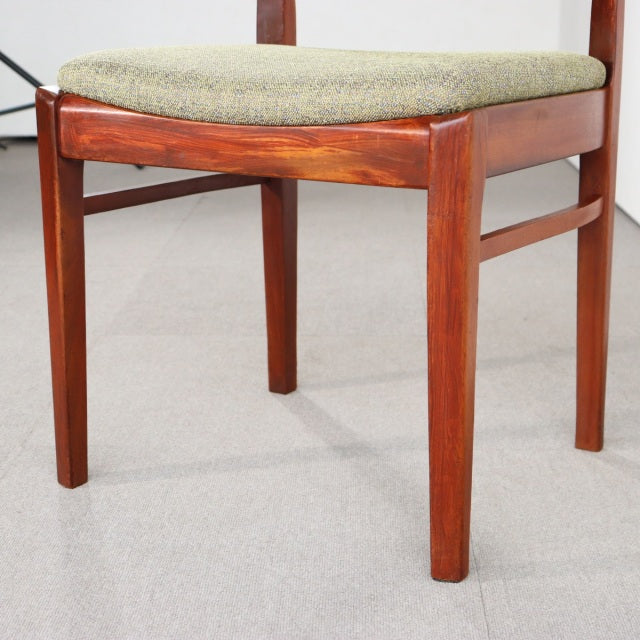 Mid-century British vintage teak dining chair with clean lines, tapered legs, and green upholstered seat cushion.