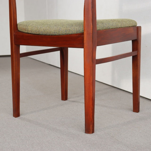 Vintage teak dining chair by NATHAN, British mid-century design with sleek legs and green upholstered seat.