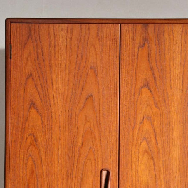 Vintage British mid-century teak wardrobe by G-Plan with rich wood grain and smooth flat doors.