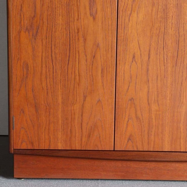 Mid-century British vintage teak G-plan wardrobe with rich wood grain and clean lines on a solid base.
