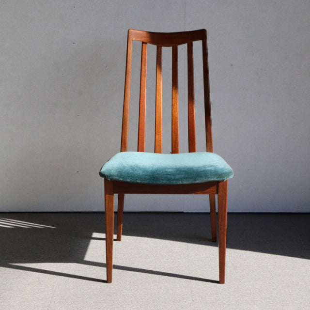 Vintage British G-Plan mid-century teak dining chair with vertical slat back and teal green upholstered seat.