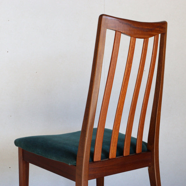 Vintage mid-century teak dining chair by British G-PLAN with tall slatted back and teal green upholstered seat.