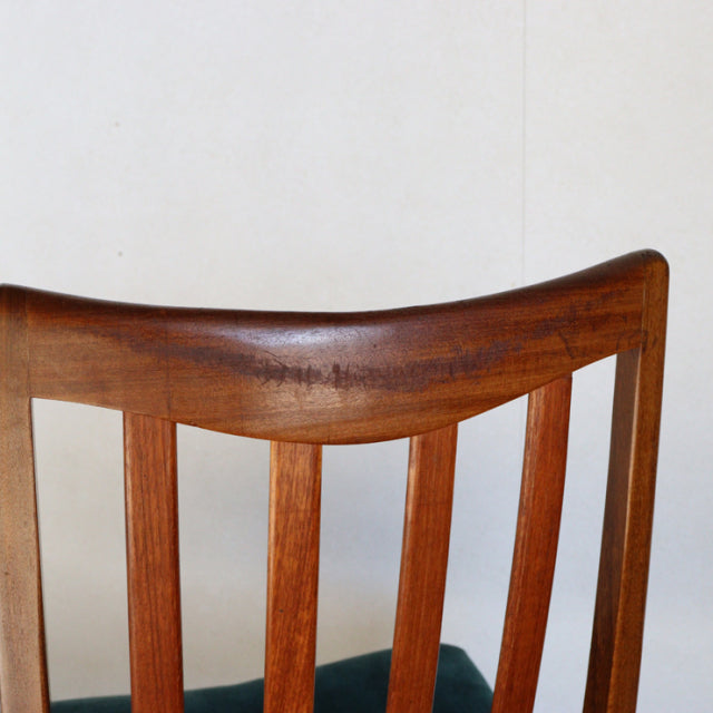 Vintage G-Plan mid-century teak dining chair backrest with rich wood grain and curved top rail.