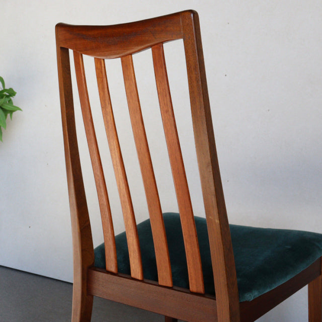 Vintage mid-century British G-PLAN dining chair in teak with vertical slat back and teal green upholstered seat.