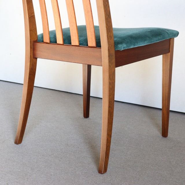 Mid-century vintage G-PLAN dining chair in teak with teal green upholstered seat and vertical slat back.
