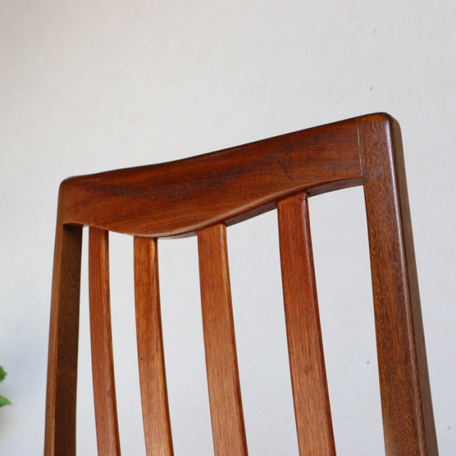 Mid-century British G-Plan vintage teak dining chair with vertical slats and smooth curved top rail.