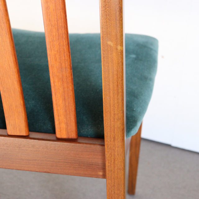 Teak wood vintage British mid-century G-PLAN dining chair with teal green upholstered seat and vertical slat backrest.
