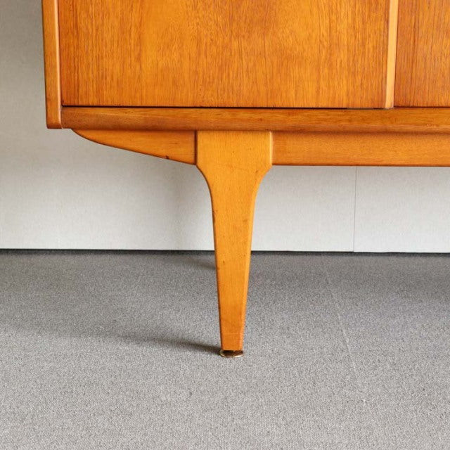 Mid-century British teak sideboard leg with fine wood grain and tapered design by Jentique.