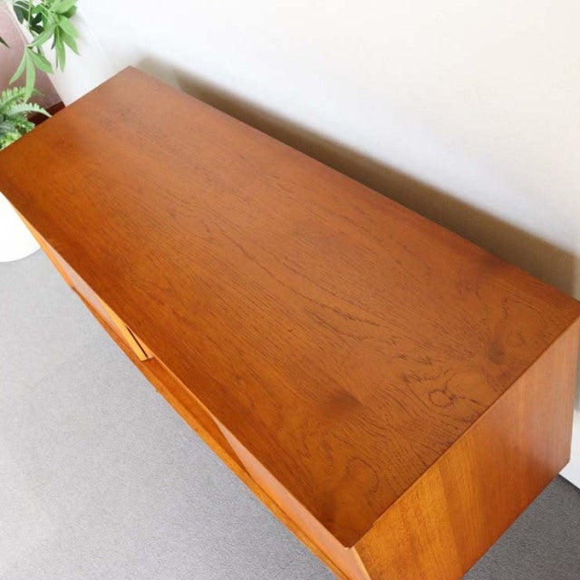 Vintage Jentique mid-century teak sideboard with clean grain, smooth surface, and minimalist British-Denmark design.