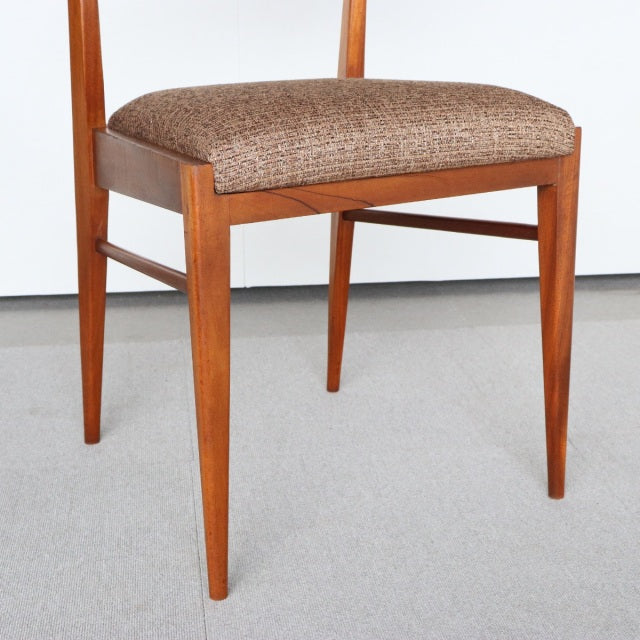 Vintage McIntosh teak dining chair with mid-century British design, textured brown upholstered seat, sleek tapered legs from .