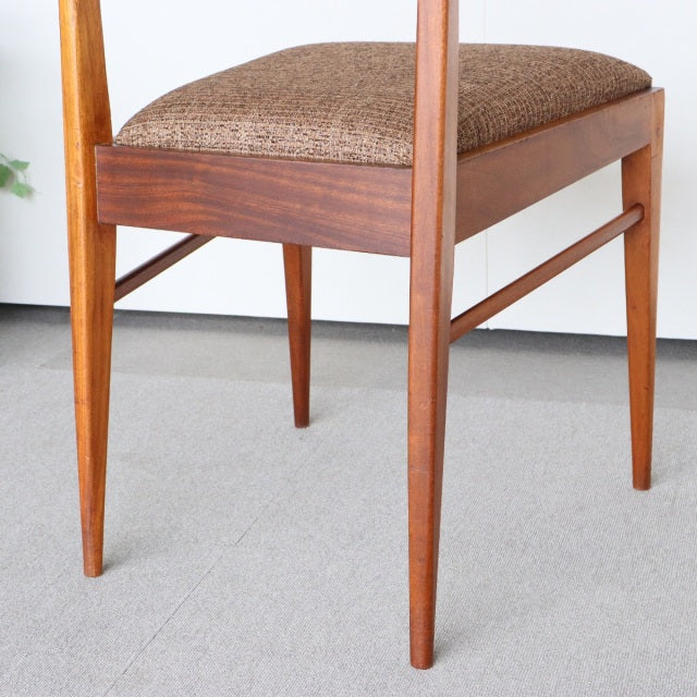 Vintage teak McIntosh dining chair with mid-century British design, tapered legs, and textured brown upholstery from Denmark.