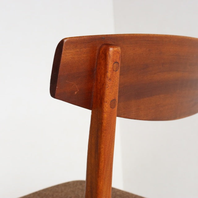 Mid-century British McIntosh dining chair in vintage teak with curved backrest and visible wood grain.