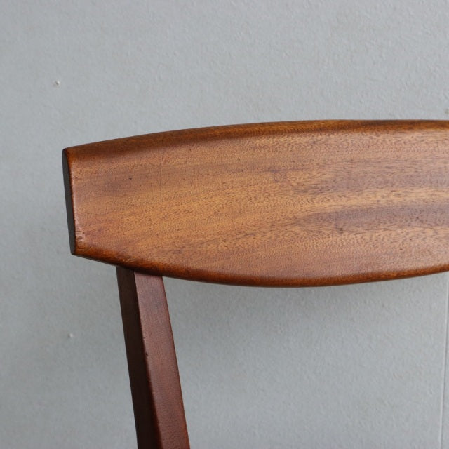 Mid-century vintage teak dining chair backrest with smooth wood grain, British McIntosh design from Denmark.