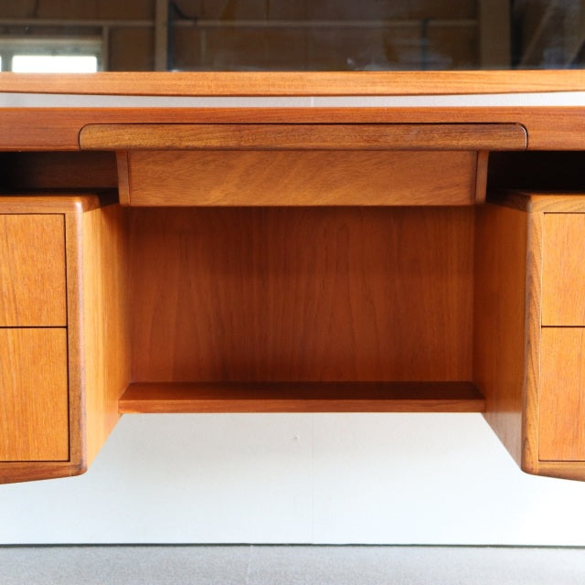 Mid-century British G-PLAN teak dressing table with rich wood grain, recessed drawer handles, and clean-lined form.