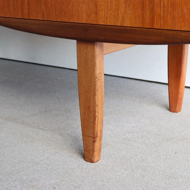 Mid-century British G-PLAN dresser leg in warm teak with visible wood grain and tapered square shape.