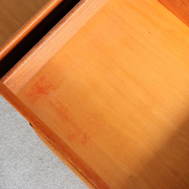 Close-up of vintage teak mid-century G-PLAN dresser drawer showcasing smooth wood grain and clean interior finish from.
