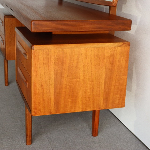 Vintage teak G-PLAN mid-century British dresser with smooth wood grain and tapered legs in Danish-inspired design.