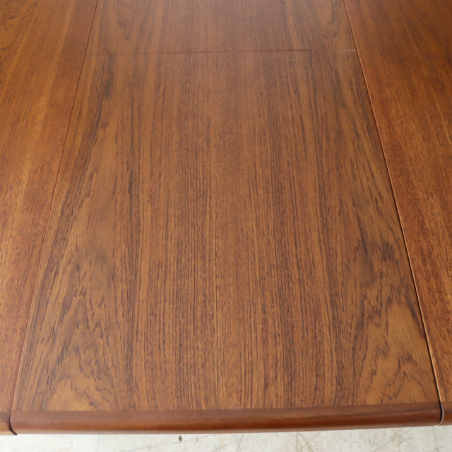 Mid-century British vintage teak dining table top with rich wood grain and smooth finish.