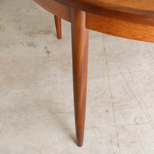 Vintage teak G-Plan mid-century dining table leg with smooth wood grain and tapered design, British Denmark style.