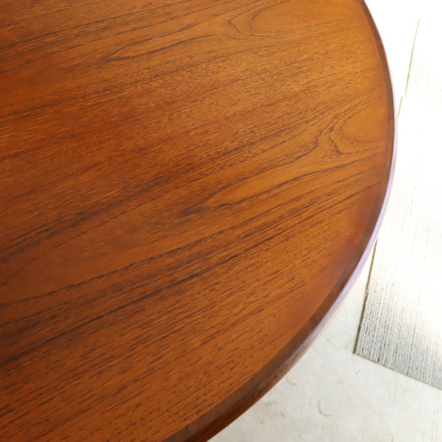 Round vintage teak dining table top showing fine wood grain and smooth mid-century British design from G-Plan.