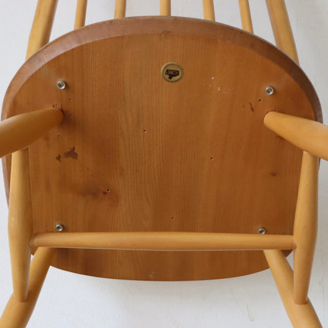Vintage British Ercol Quaker chair base in polished teak, showcasing mid-century wood grain and rounded leg design from.