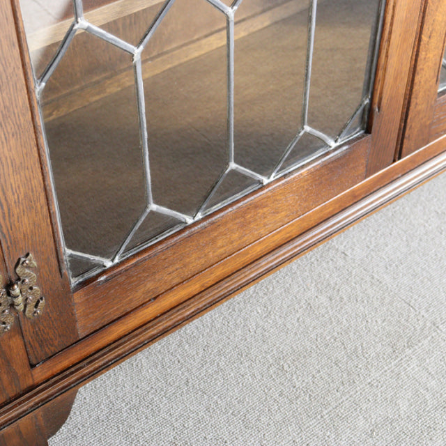 Vintage teak cabinet door from British mid-century Jaycee, with intricate leaded glass and rich wood grain.