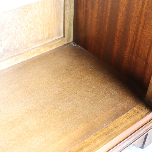 Close-up of vintage teak wood grain interior corner inside British mid-century Jaycee cabinet from Denmark.