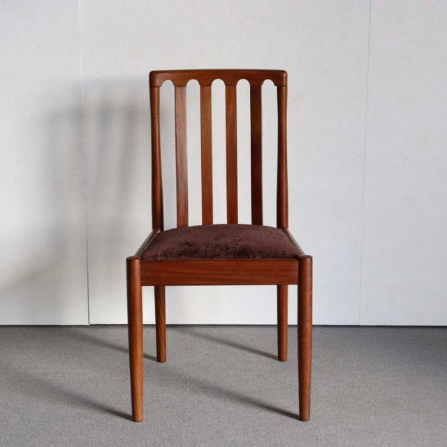 Mid-century British vintage teak dining chair by Meredew with vertical slatted back and brown upholstered seat.