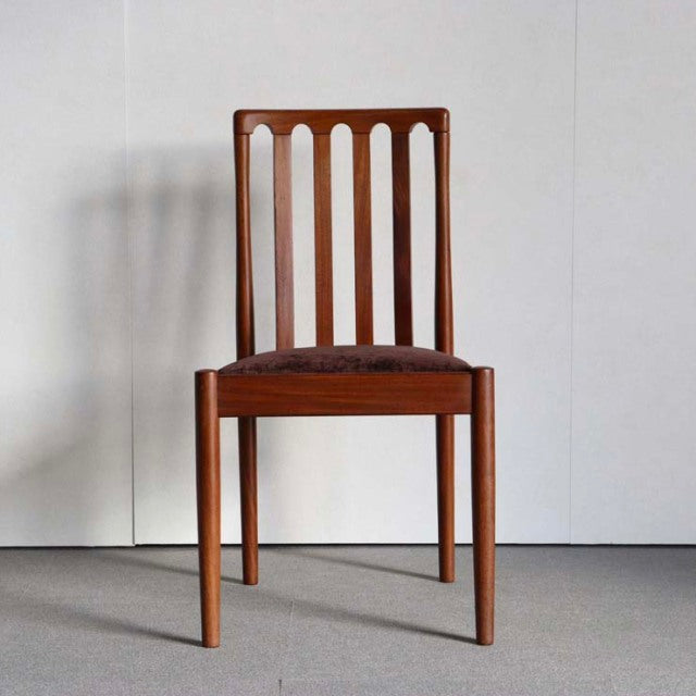 Vintage Meredew teak dining chair from mid-century British-Denmark design with vertical slat back and tapered legs.
