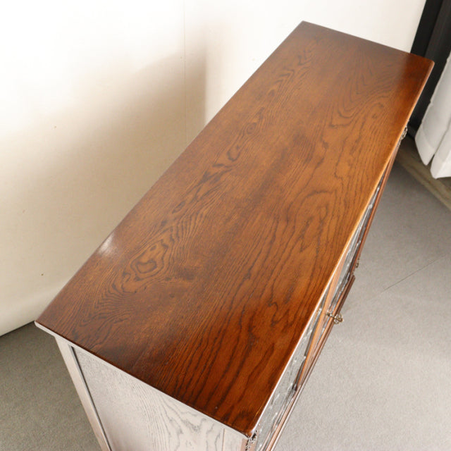 Vintage British Jaycee teak cabinet with smooth wood grain top, mid-century Danish design, sturdy legs.