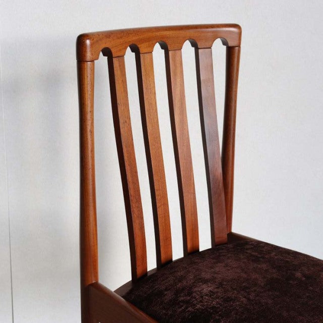 Vintage mid-century Meredew teak dining chair with British-Danish design, vertical slatted backrest, and rich wood grain.