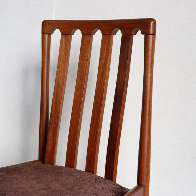 Vintage British mid-century teak dining chair by Meredew with vertical slat back and brown upholstered seat.